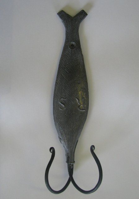 A Cod Jigger coat hook made from the original Robert Slade mould.  These coat hooks are made by the Trinity Historical Society. 