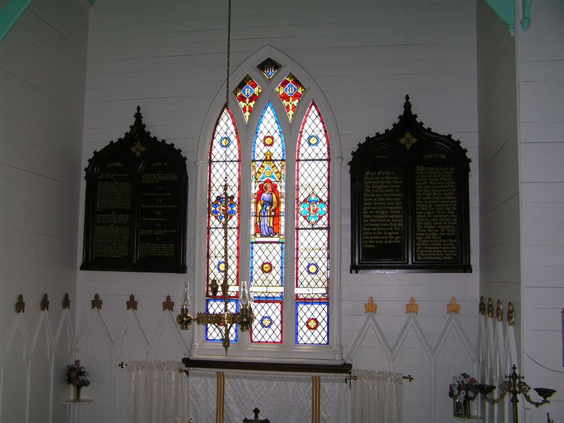 A view of the Altar which displays the Altar Chandelier hanging in the center.