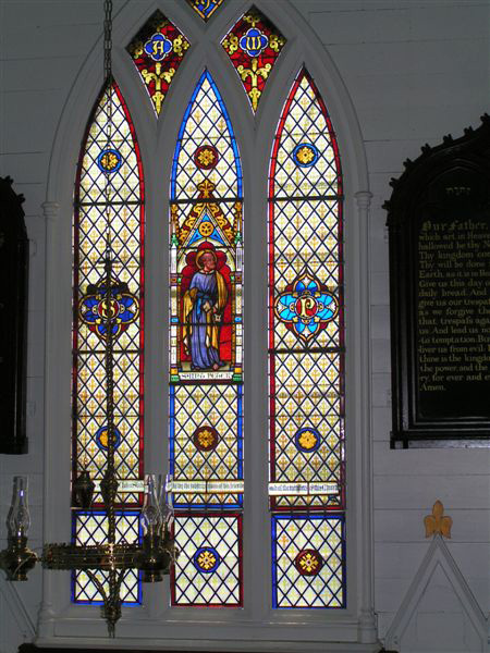 A stain glass window in memory of John Slade located in St. Peter's Anglican church Twillingate, Newfoundland, Canada.