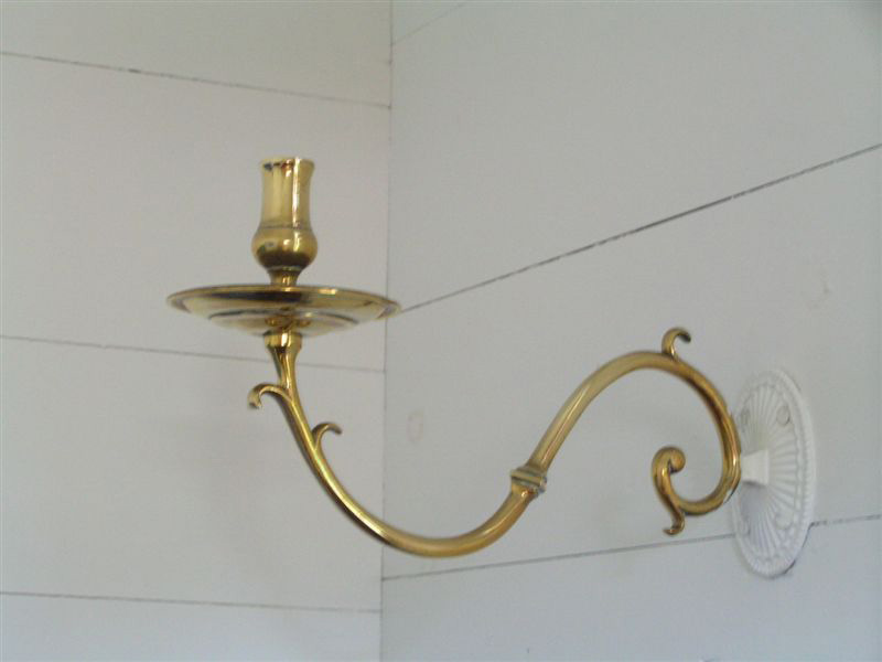 This single brass lamp branch is located in St. Peter's Anglican church, Twillingate, Newfoundland, Canada. This lamp was donated to the church by John Slade in 1845. 